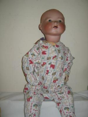 Appraisal: An Armand Marseille bisque head baby doll with blue glass