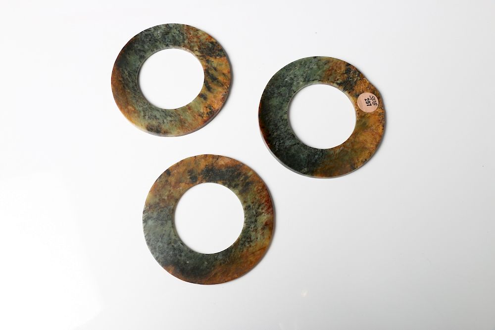 Appraisal: THREE-PIECE CHINESE JADE BI DISC SET The discs are of