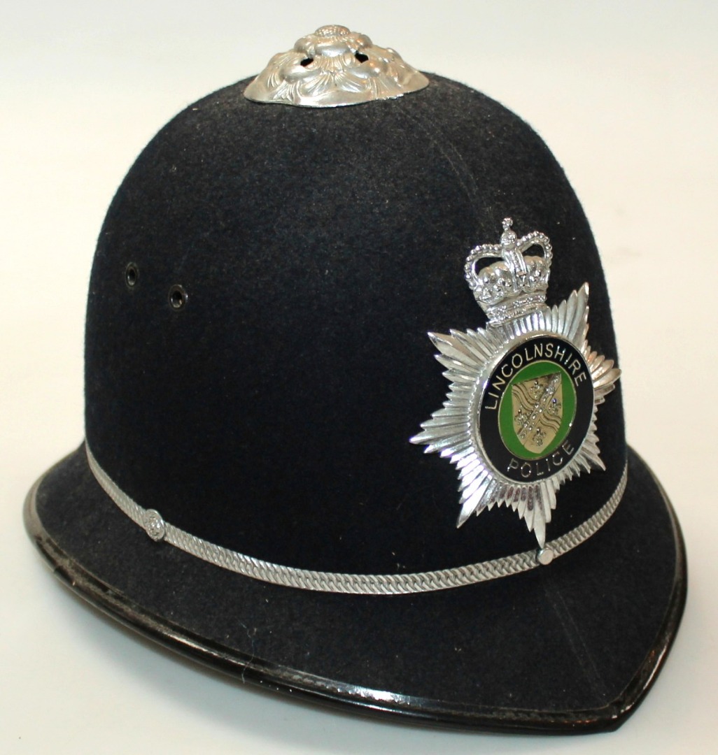 Appraisal: A thC policeman's helmet with Lincolnshire police badge Cromwell label