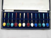 Appraisal: A boxed set of twelve enamelled silver coffee spoons by