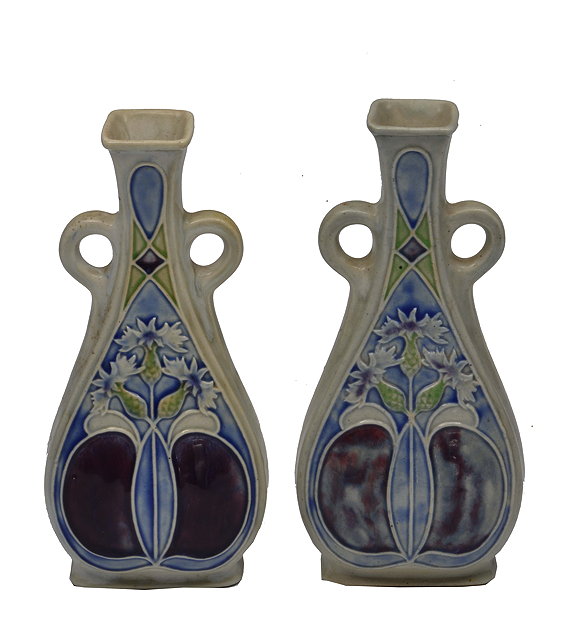 Appraisal: A PAIR OF ROYAL DOULTON STONEWARE VASES decorated with coloured