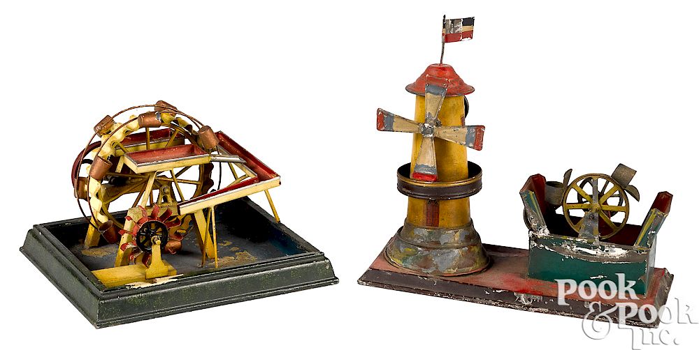 Appraisal: Two painted tin waterwheel steam toy accessories Two painted tin