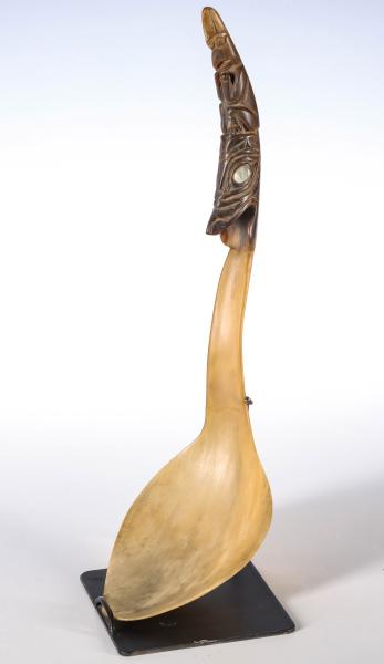 Appraisal: A TH C ESKIMO CARVED HORN LADLE WITH TOTEMIC HANDLEThe