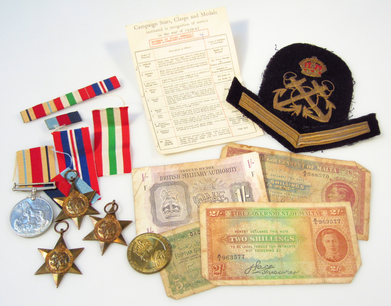 Appraisal: Various military patches medals and banknotes to include military one