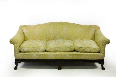 Appraisal: A deep-seated three-seater sofa on ball and claw front feet