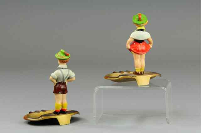 Appraisal: PAIR OF AUSTRIAN FIGURAL SOUVENIR ASHTRAYS Painted die-cast trays with