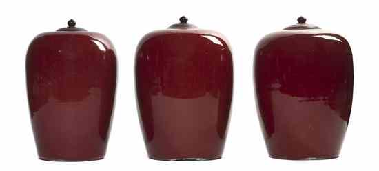 Appraisal: Three Chinese Sang de Boeuf Ginger Jars each of ovoid