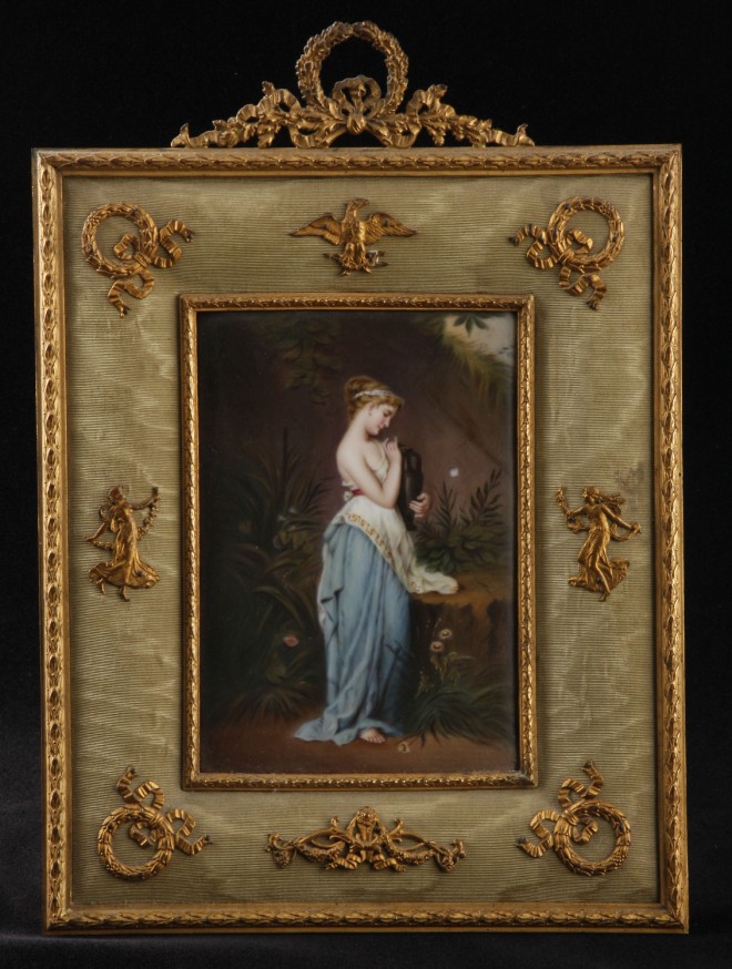 Appraisal: Hand painted porcelain plaque features classical female holding urn surrounded