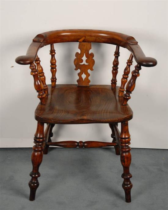 Appraisal: An English Captains Chair of mixed woods with a pegged