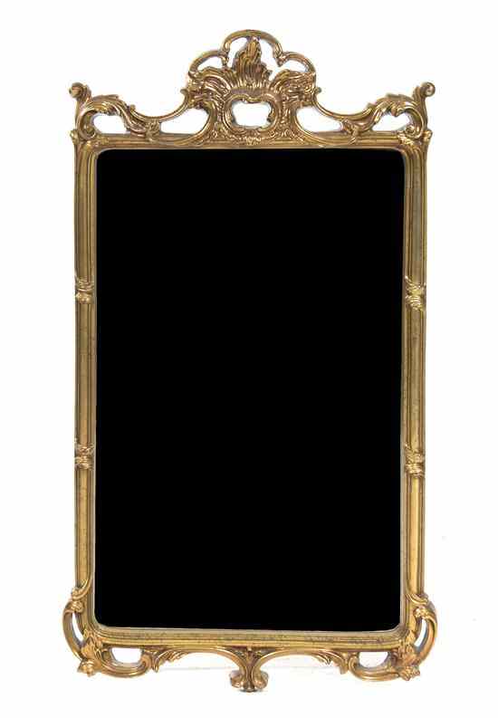 Appraisal: A Contemporary Giltwood Mirror having an open Rococo crest over