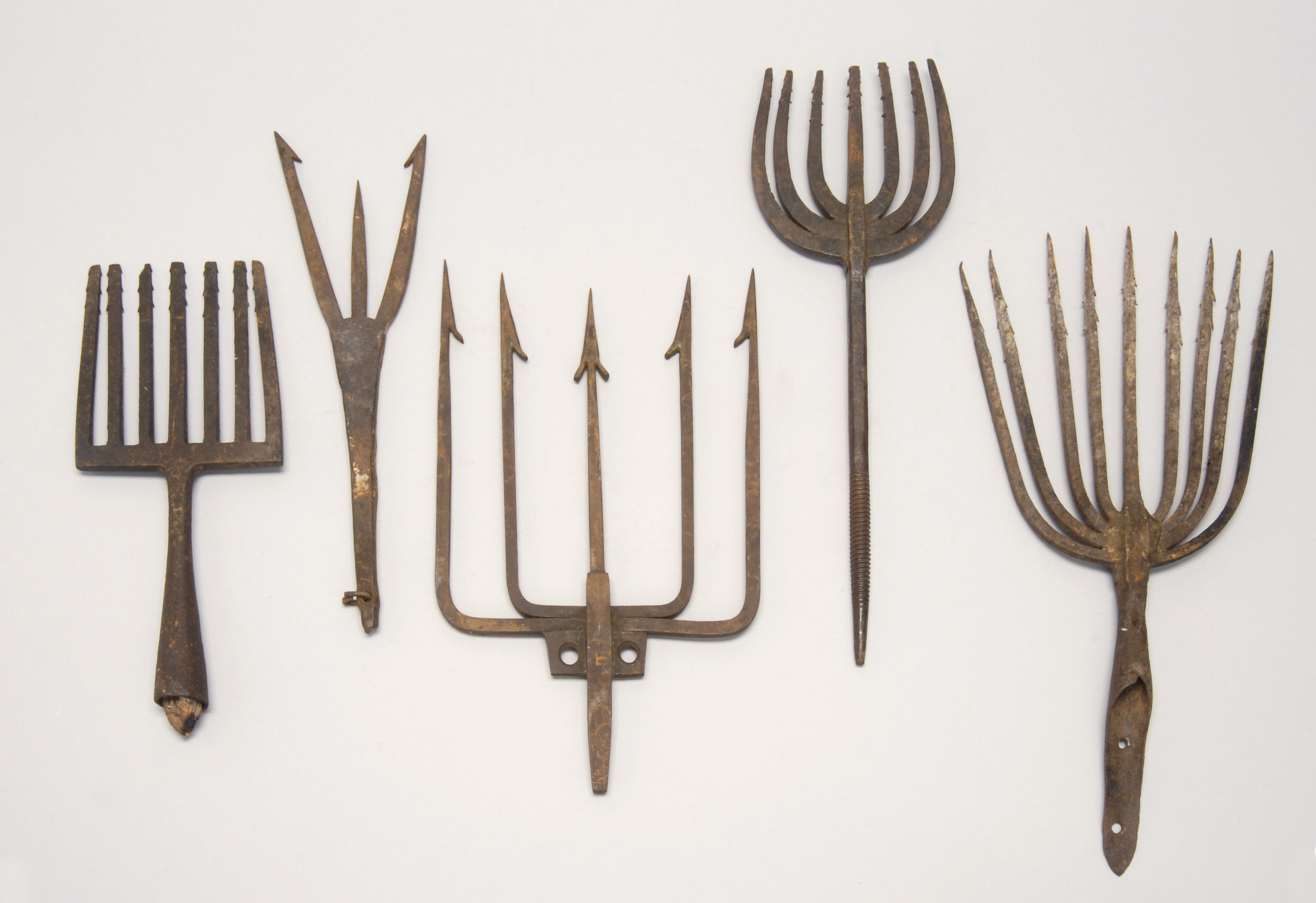 Appraisal: FIVE CAST IRON EEL AND FISH SPEARS Late th Early