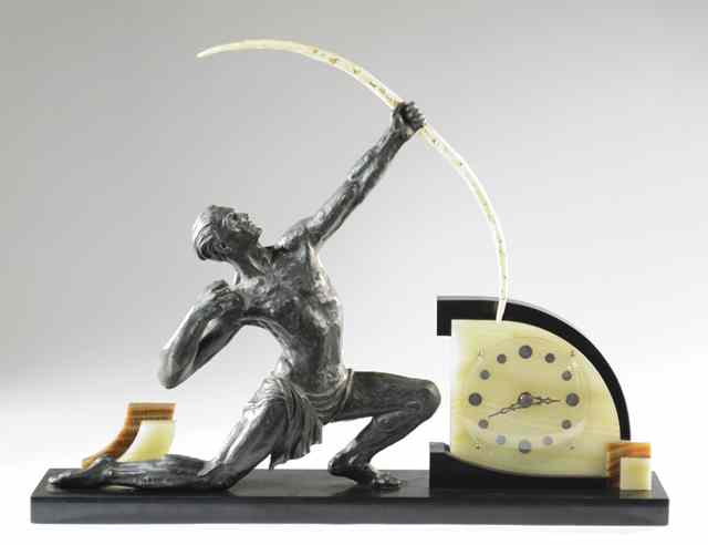 Appraisal: ART DECO FIGURAL MALE ARCHER CLOCK the metal sculpture of