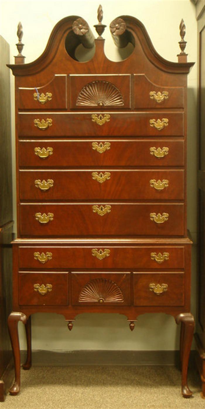 Appraisal: Mahogany Queen Anne style piece highboy with flamed finials bench