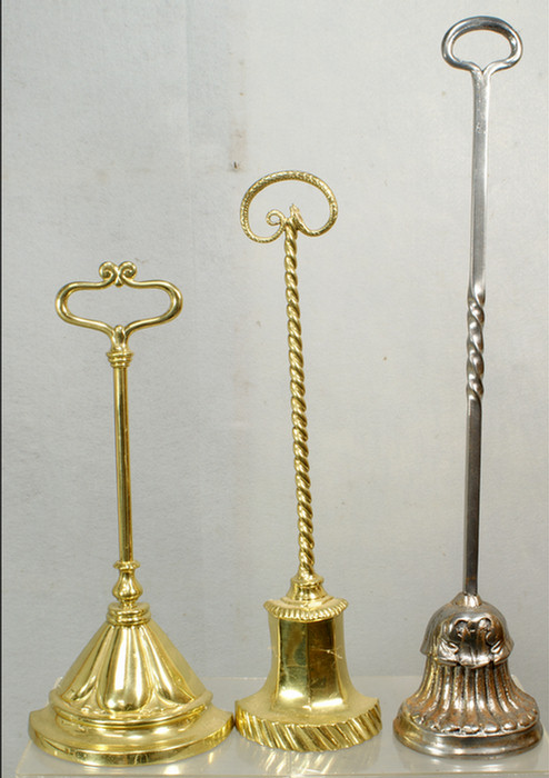 Appraisal: door stops two polished brass one polished steel tallest h