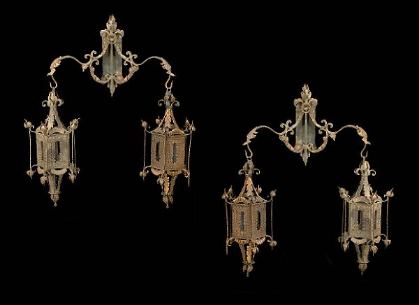 Appraisal: A pair of Moorish style patinated metal hanging lanterns The