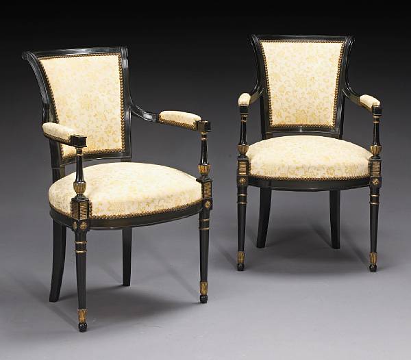 Appraisal: A pair of Directoire style parcel gilt ebonized armchairs Each