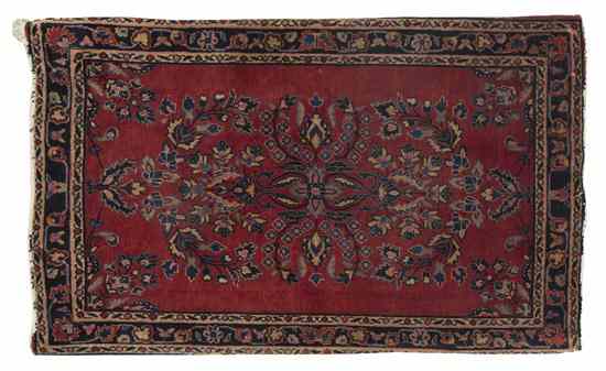 Appraisal: A Sarouk Wool Mat having a foliate center medallion within