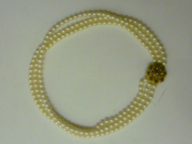 Appraisal: A CULTURED PEARL NECKLACE having three rows of uniform pearls