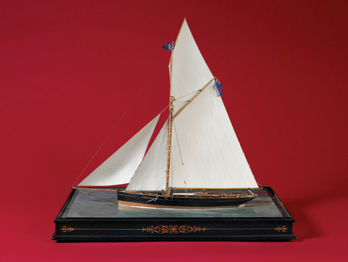 Appraisal: WATERLINE MODEL OF A BRITISH CUTTER YACHT The carved and