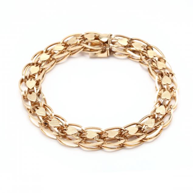 Appraisal: Gold Heart Motif Bracelet The bracelet with a row of