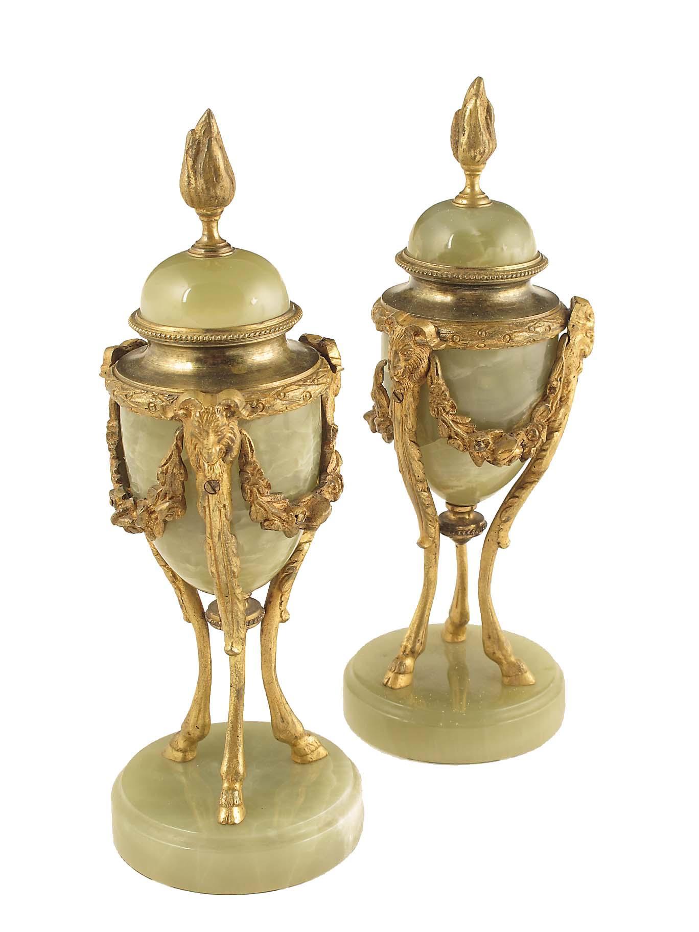 Appraisal: A pair of French onyx and gilt metal mounted urns