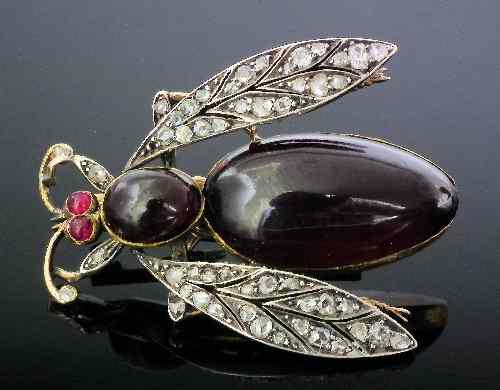 Appraisal: A late Victorian gold coloured metal mounted garnet and diamond