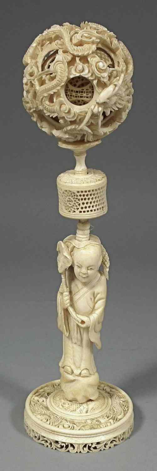 Appraisal: A Chinese ivory six division puzzle ball deeply carved with