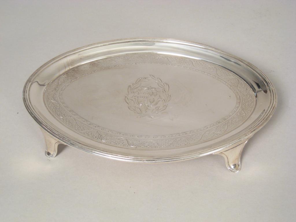 Appraisal: A George III oval Teapot Stand with bright cut frieze