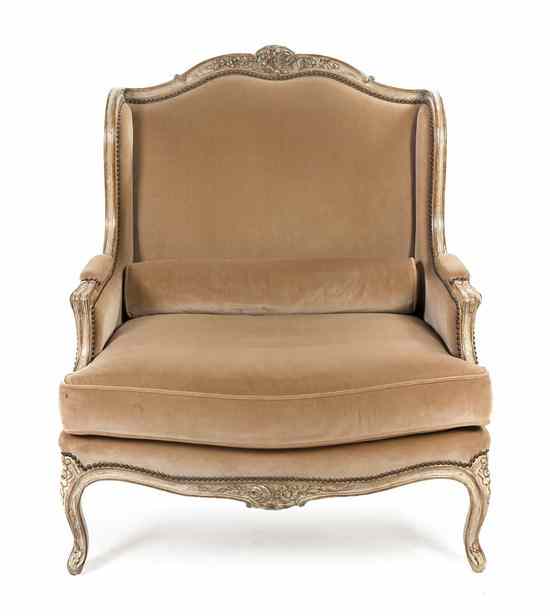 Appraisal: A Louis XV Style Upholstered Settee with everted arms enclosing