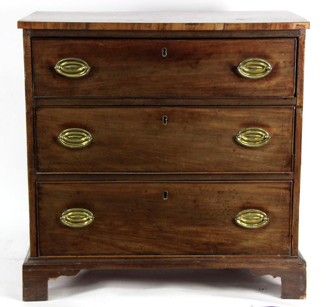 Appraisal: A th Century mahogany chest of three long graduating drawers