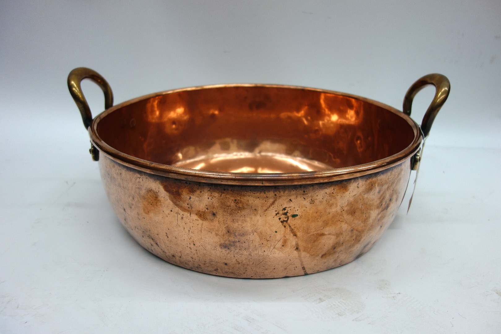 Appraisal: A large Victorian circular copper preserve pan with brass side