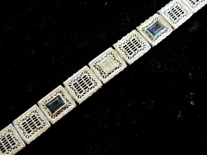 Appraisal: karat white gold filigree synthetic sapphire and diamond braceletRectangular links