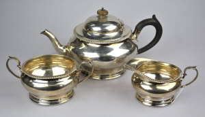 Appraisal: A silver three-piece tea service with scroll handles Edward Barnard