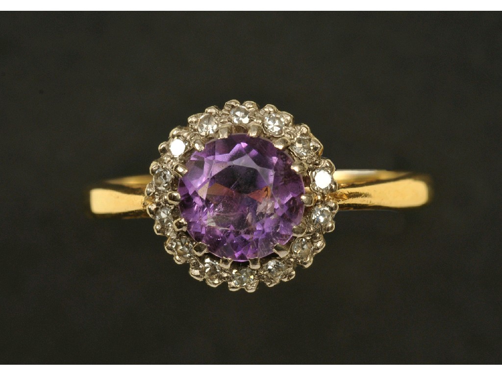 Appraisal: An Amethyst and Diamond Cluster Ring the circular-cut amethyst claw-set