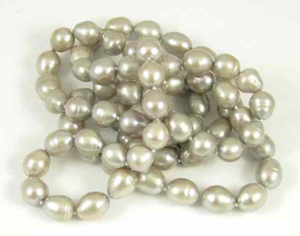 Appraisal: OPERA LENGTH PEARL NECKLACE strung with well matched baroque pearls