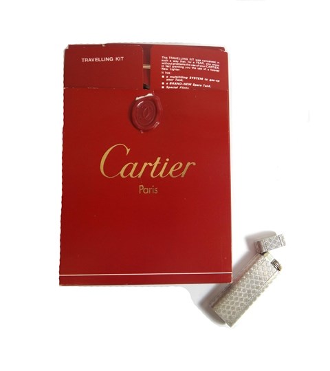 Appraisal: A silver plated Cartier gas lighter of curved rectangular form