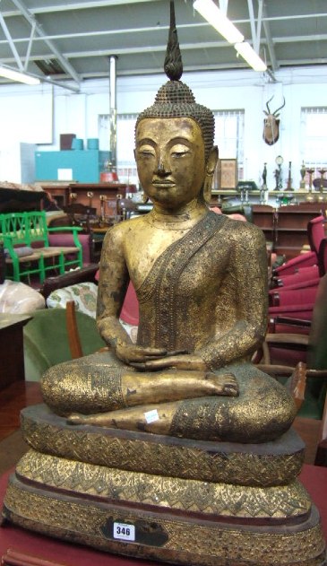 Appraisal: A Sukhotai style gilt metal figure of Sakyamuni seated in