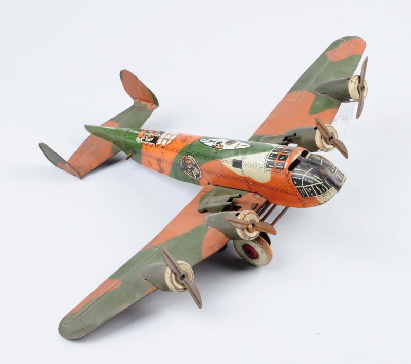 Appraisal: Marx Tin Litho Camouflage Airplane Original guns mounted on wing