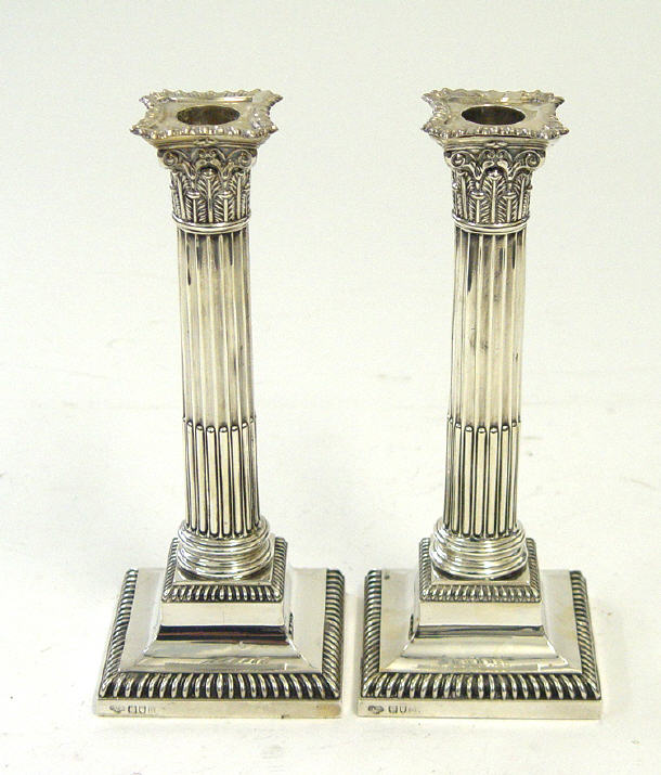 Appraisal: Pair of square based reeded silver column candlesticks London cm