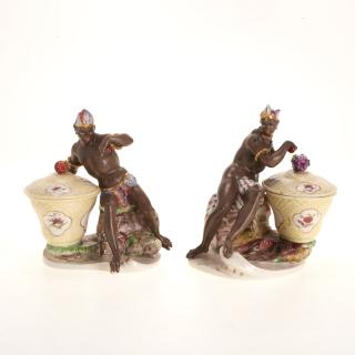 Appraisal: Pr Nymphenberg blackamoor porcelain sweetmeat jars Pr Nymphenberg blackamoor porcelain