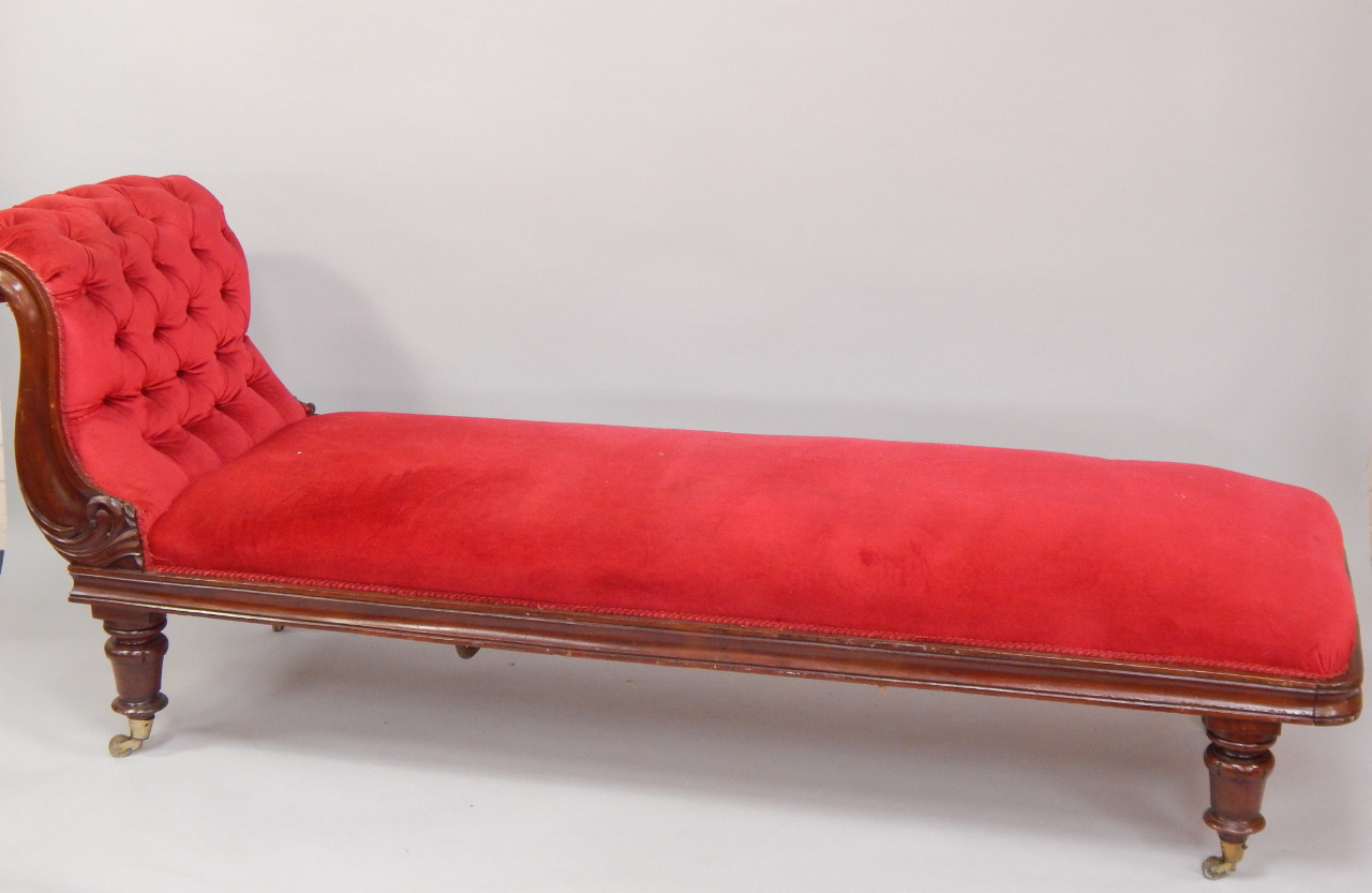 Appraisal: A Victorian mahogany chaise longue upholstered in red button back