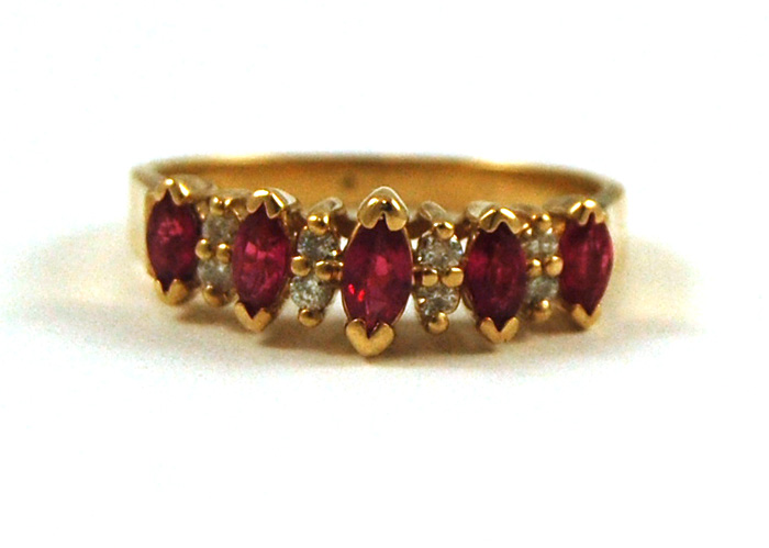 Appraisal: RUBY DIAMOND AND FOURTEEN KARAT GOLD RING set with five