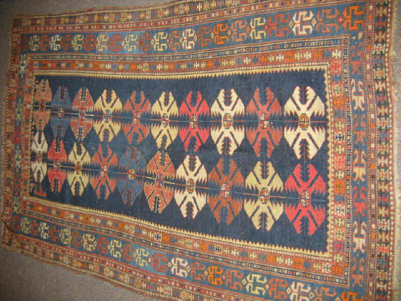 Appraisal: EARLY TH CENTURY SHIRVAN TRIBAL THROW RUG The indigo field