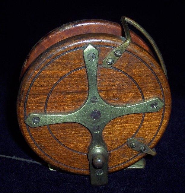 Appraisal: A Nottingham star back fishing reel with line guard and