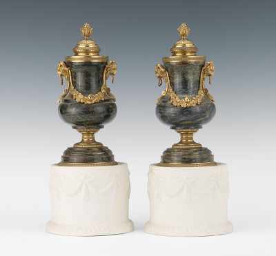 Appraisal: A Pair of Marble Urn Shape Candle Holders with Ormolu