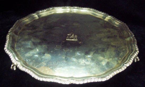 Appraisal: A circular salver with piecrust gadroon border on three claw