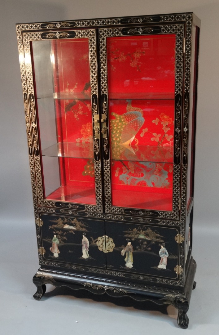 Appraisal: A thC Chinese lacquer finish display cabinet the rectangular outline