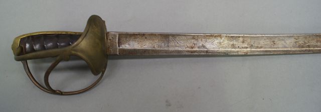 Appraisal: A German Cavalry sword inch curved blade with clip point