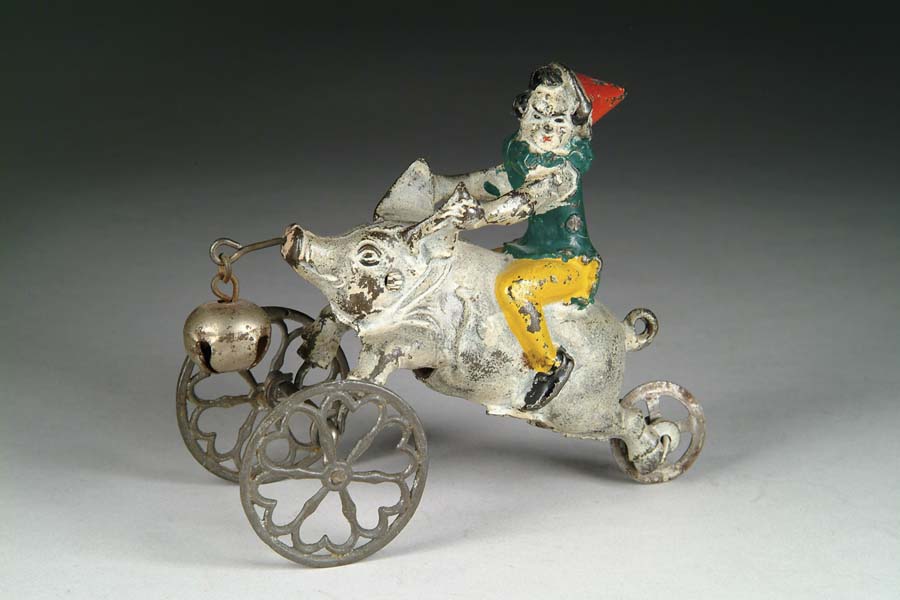 Appraisal: PIG WITH CLOWN RIDER BELL TOY Manufactured by The Gong