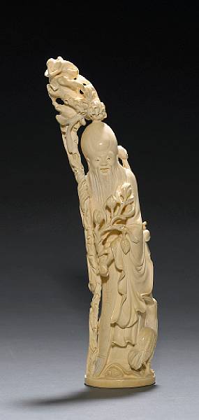 Appraisal: A carved ivory figure of Shoulao th Century Shown standing